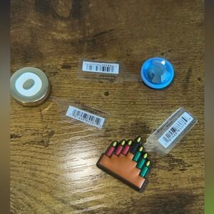 Lot of 3 new with tags Crocs Jibbitz. Blue gem Gold O and Kinara accessories